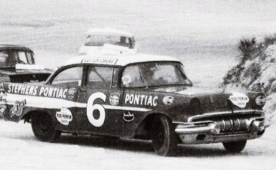 Cotton Owens hits a turn in 1957...