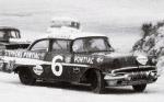 Cotton Owens hits a turn in 1957...