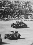 Fireball Roberts #M-3 and Banjo Matthews #49Jr. in the North Turn in the 1955 Modified-Sportsman race.