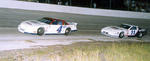 Bobby Gill #4 races with David Rogers...
