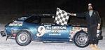 Bruce Maynard of Lakeland takes a Mini Stock win in 1986...