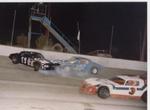 Jeff Quinette #19 spins in front of Ray Smith as Jim Groff #3 passes underneath..