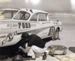 A mechanic works on Joe Weatherly's Holman-Moody Ford before the 1958 GN race (Orr Family Collection)