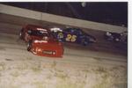 Ronnie Burkett spins his Limted Late Model as Timmy Todd gets by...