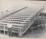 Promoter Frank Dery in front of the turn four grandstands just after they were installed.. (Joslin Collection)