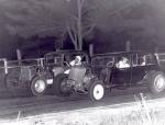 Limited Sportsman action... Car on the inside has an in-line Willys six cyl. and the outside car has a Ford Flathead engine...