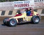 Jimmy Riddle sliding through turn three (Gene Marderness Photo)