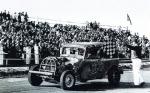 Will Cagle takes a checker in his very first race car circa 1955 and the Sunbrock Speedway that was in Lakeland...