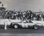 Jimmy Crowe gets the checker after a win at Vero Beach...