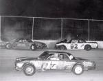 1974 - Nokie Mallory and Dick Anderson in the wall as Larry Rogero passes...