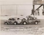 Phil Greenwood's #90 Datsun getting a nudge from the Anglia of Bob Williams as Bill Maples passes...
