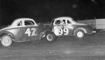Herb Madray (99) in his Hudson coupe avoids a spinning car around 1957 (Marty Little Collection)