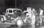Herbie Tillman checks out the damage to his racer...