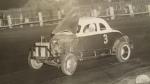 1956 - Ernie Bass racing with the hood up...