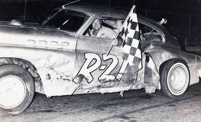 Red Begtrup with a 1966 checker at Gold Coast Speedway...