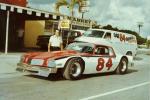 Johnny Merendino poses with his car to be driven during the 1976 season by Gary Balough...