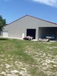The shop is located at 30201 Fullerville Road just west of Deland - Phone # is (352) 771-0055...