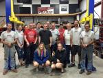 The whole gang poses back at the shop after a long, hard night at the races...