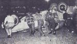 Track crews get set to get Ken Atkins' car back on all fours after a roll-over during Gold Coast Speedway Figure-8 action...
