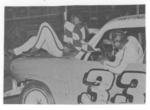 Figure 8 driver Elmer Seiffert gives the flagman a lift - 1969