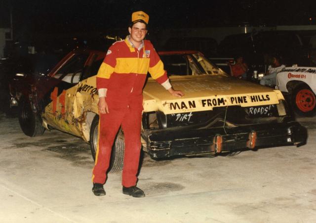 "The Man from Pine Hills" (at the time), Ted Head, poses with his Bomber car in 1990 (Jim Jones Photo)