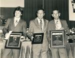 NASCAR's Bill France, Jr. gives the 1980 championship award to Wayne Neidecken, Jr. (L) and owner award to his dad Wayne, Sr.