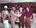 Ed Samples and Fonty Flock get trophies and congrats from NASCAR's Cannonball Baker and Bill France, Sr. circa 1947-48...