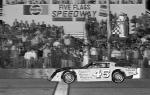 Gene Morgan takes the checker to win the 1982 Snowball Derby (David Allio Photo)