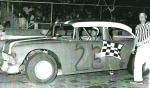 Dale Creech takes a win at Treasure Coast on April 6, 1968 - with flagman Flip Bancroft...