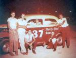 Marty Handshaw and crew with his '37 Ford sedan in 1958. He may have run this car at Daytona Beach in '57 as a Sportsman..