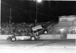 1970 - Dale Mixon rides the wall as Pete Leufkins tries to avoid (Bill Posey Collection)...