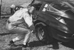 1965 - Don Yenko checks out a flat left rear tire on his 'vette (Courtesy barcboys.com)