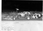 Buster Standridge #04 and Bill Posey bear down on a spinning car (Posey Collection)
