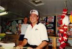 NASCAR star Rick Mast signs autographs...