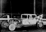 Curly Custis takes a Limited Sportsman checker in 1965  (William Bussart Photo)