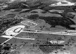 Another aerial view of the construction showing the original 5/8 and 1/4 mile ovals, drag strip and karting oval-road course...
