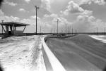 Construction of the track is nearly complete in late 1977...