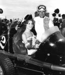 Pete Folse at the 1962 IMCA Winternationals with Miss Tampa, Janet Palmer sitting in his car (Cal Lane Collection)