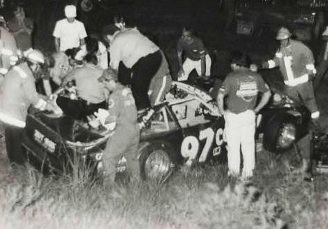 Richard Brinson is cut from his car after sliding in oil and hitting the dirt bank - was badly hurt but recovered...