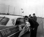 1962 Firecracker 400 - Florida U.S. Senator George Smathers gets a close look at Bobby Johns' Pontiac (State Archives of Florida